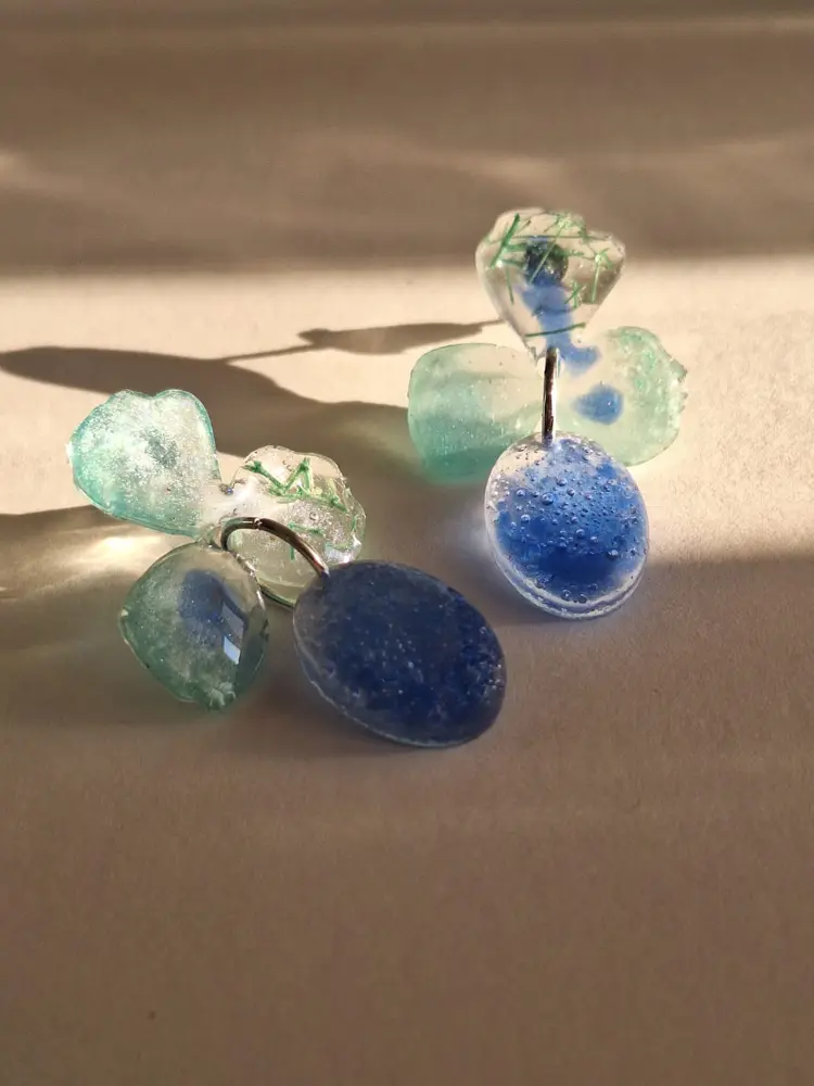 Clear resin earrings in blue and aqua tones